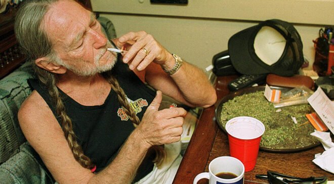 Willie Nelson smoking marijuana